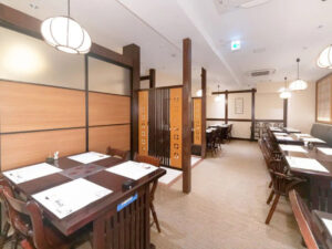 Our dining area features tables for four guests.
